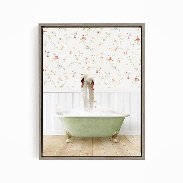 A pair of swans sitting in a green bathtub, with a floral wallpaper in the background.