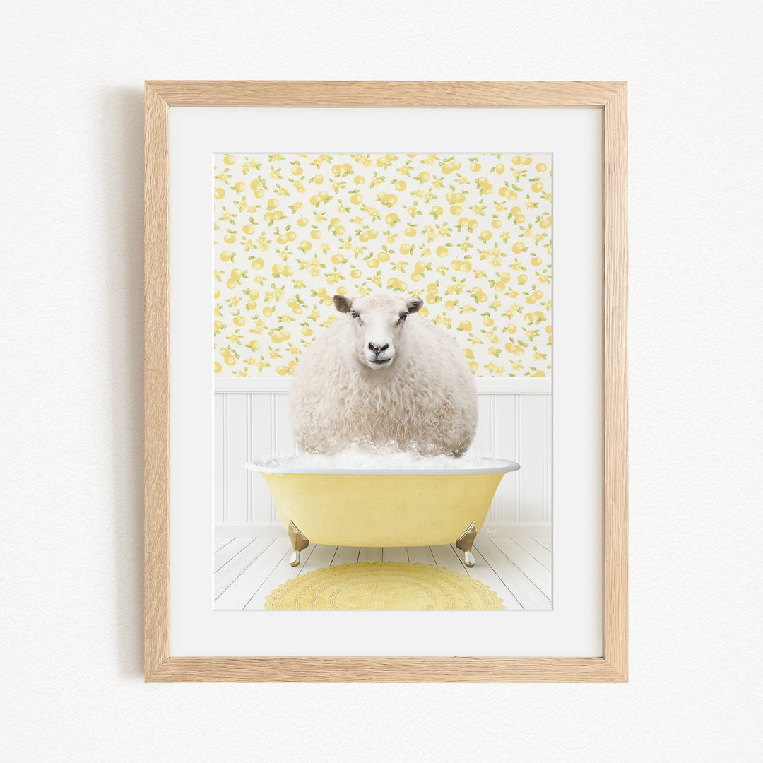 A fluffy white sheep sits in a yellow bathtub, surrounded by a yellow floral patterned wall.