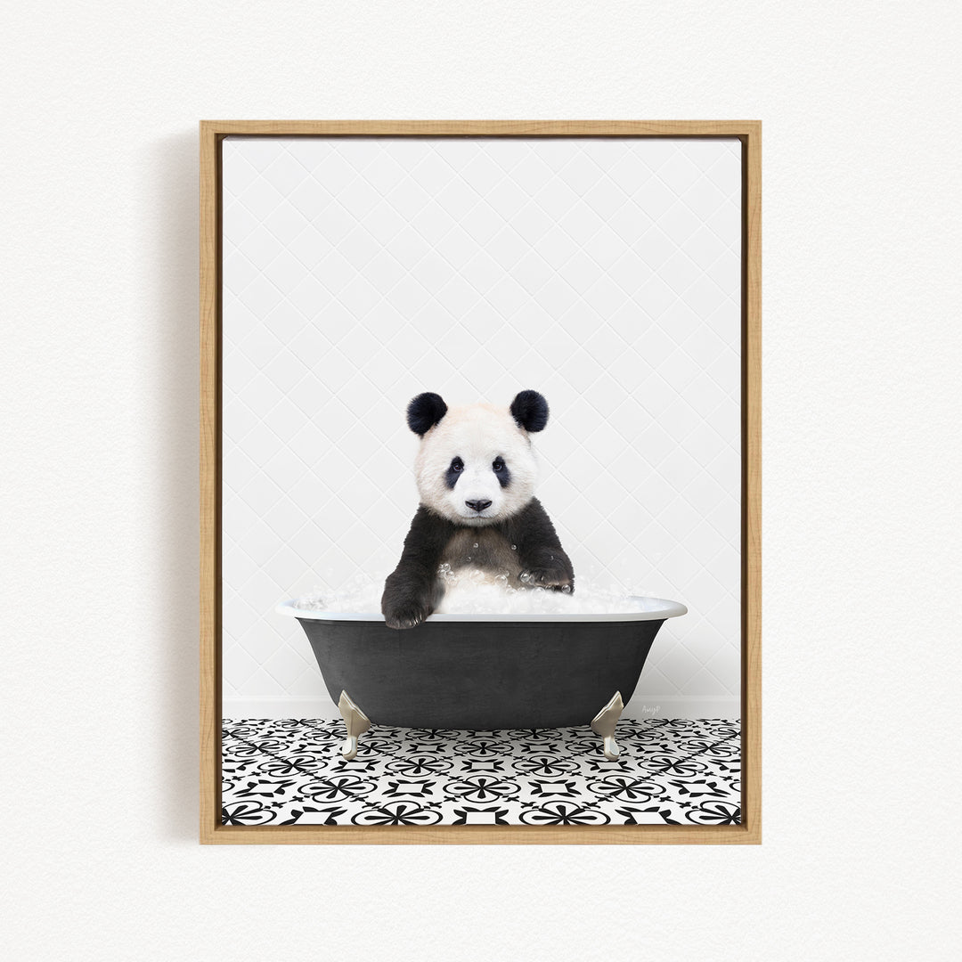 A panda bear sitting in a bathtub filled with bubbles, surrounded by a black and white patterned floor.
