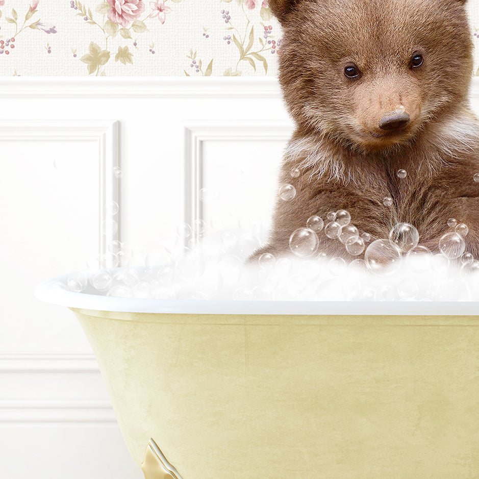 a brown bear sitting in a bath tub filled with bubbles