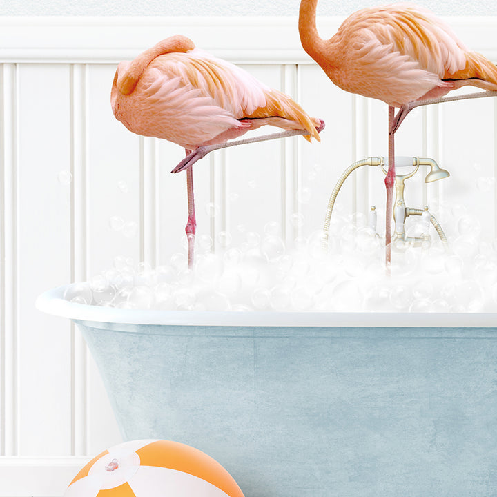 two flamingos standing in a bathtub full of bubbles