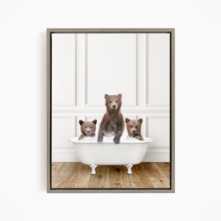 Three adorable brown bears sitting in a white bathtub, enjoying a relaxing bath together.