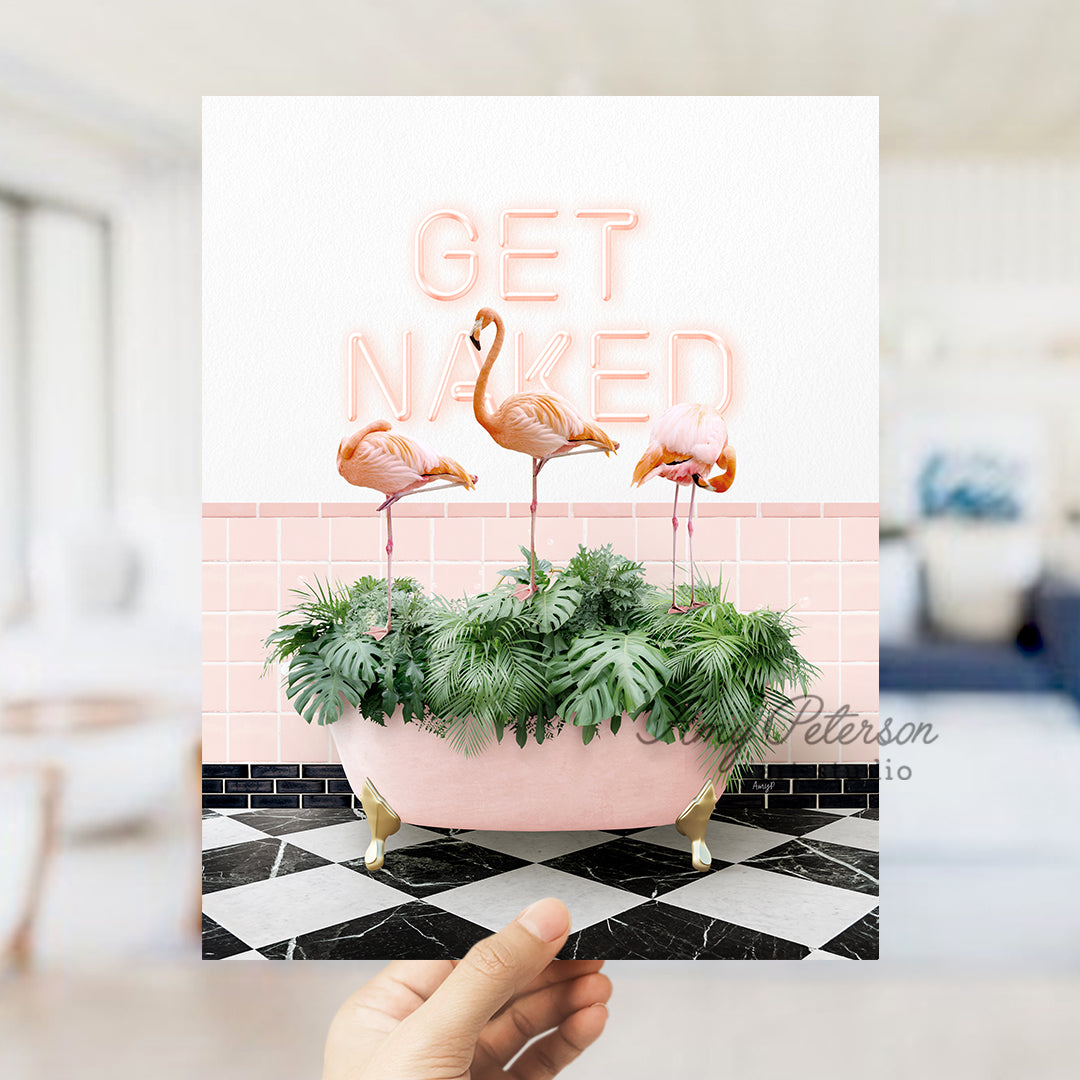 a person holding up a card with flamingos in a bathtub