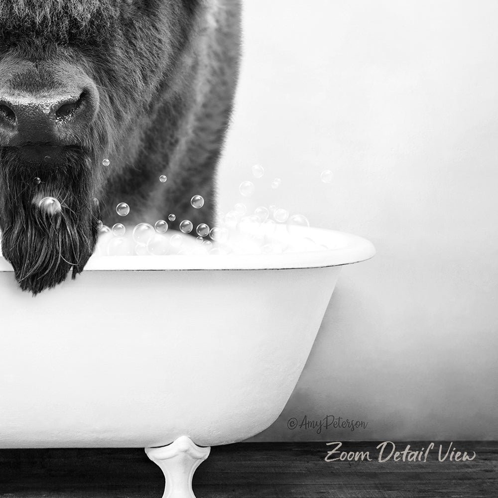 A close-up black and white image of a dog's face partially submerged in a bathtub filled with bubbles.