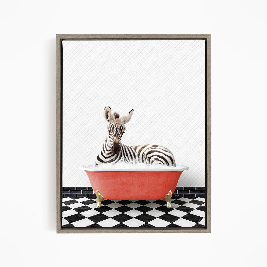 A zebra is sitting in a red bathtub on a black and white checkered floor.