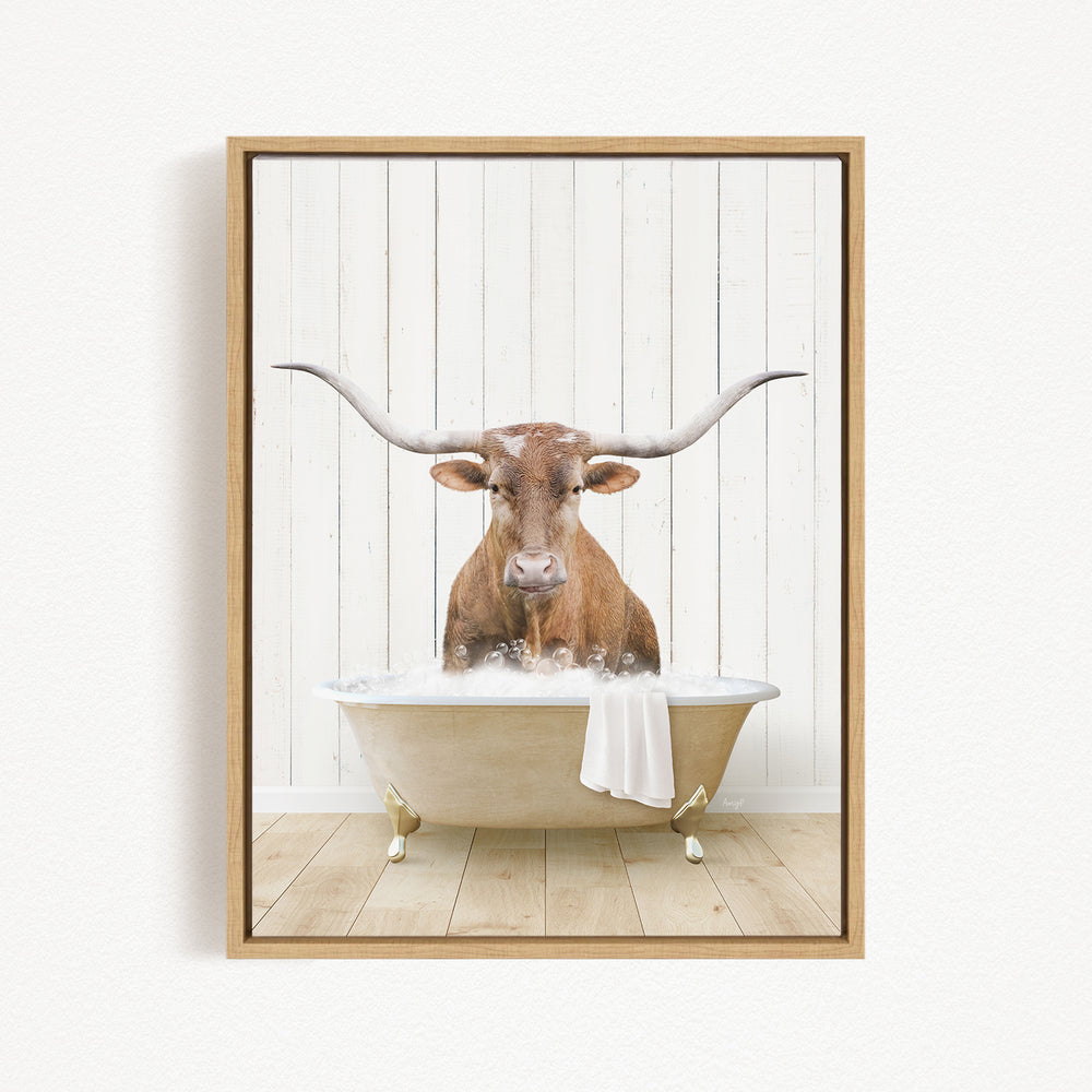 A brown bull with long horns is sitting in a white bathtub filled with water, creating a whimsical and playful scene.