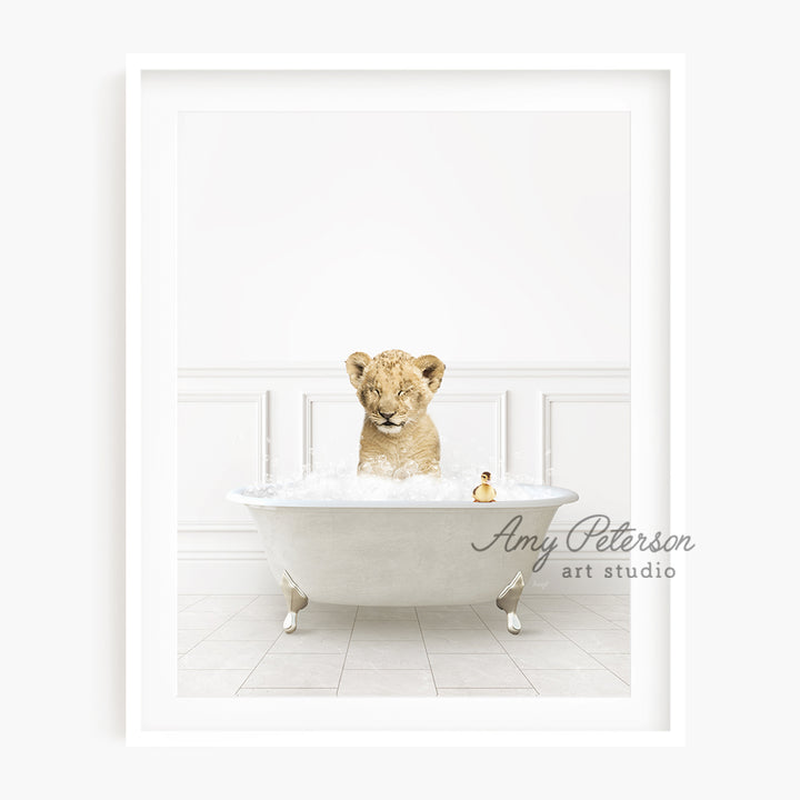 a baby lion sitting in a bath tub