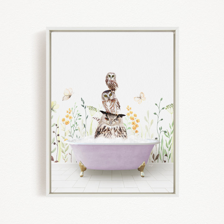 A framed illustration depicting three owls sitting in a bathtub, surrounded by flowers and butterflies.