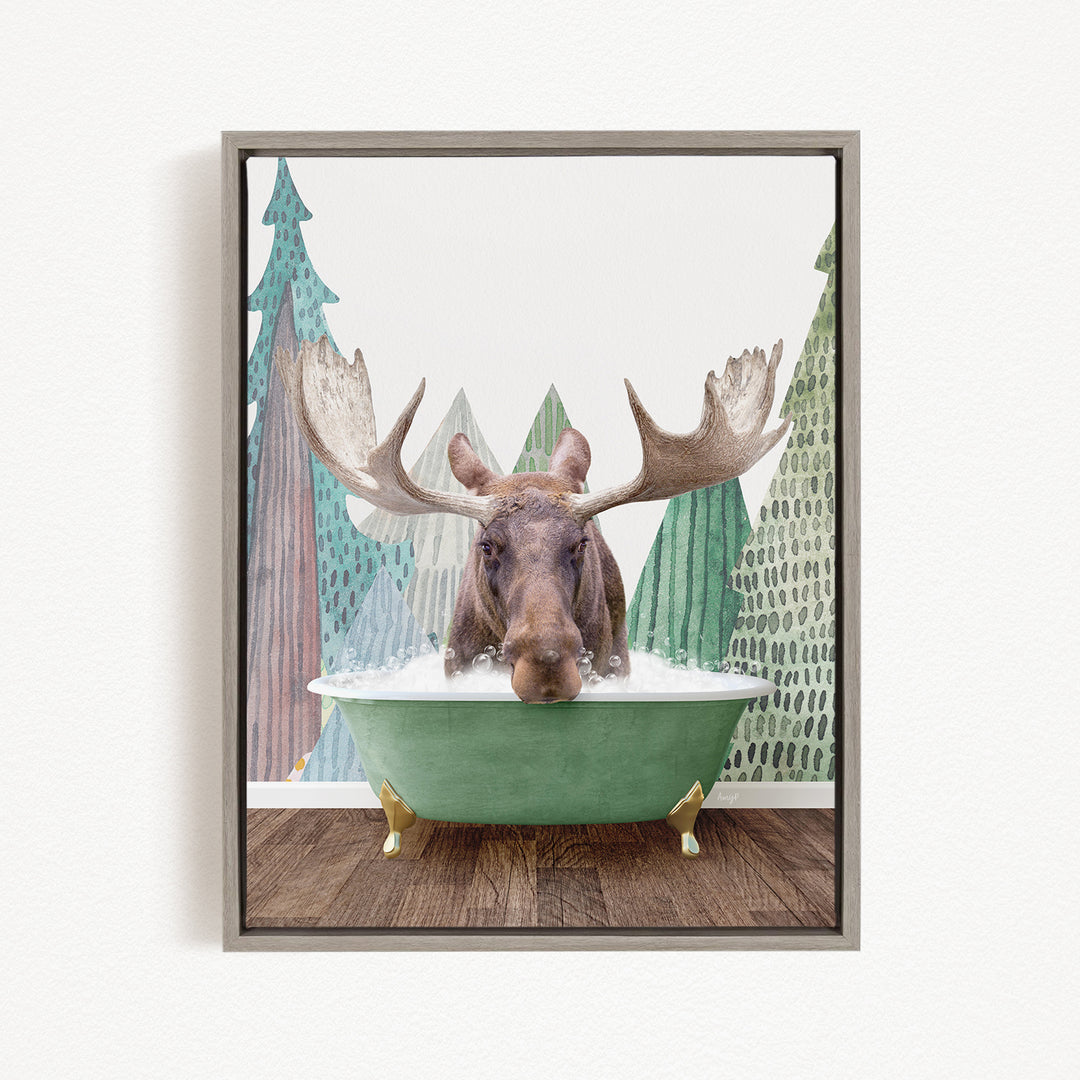 A moose with large antlers is sitting in a green bathtub, surrounded by a forest scene with trees and a snowy landscape.