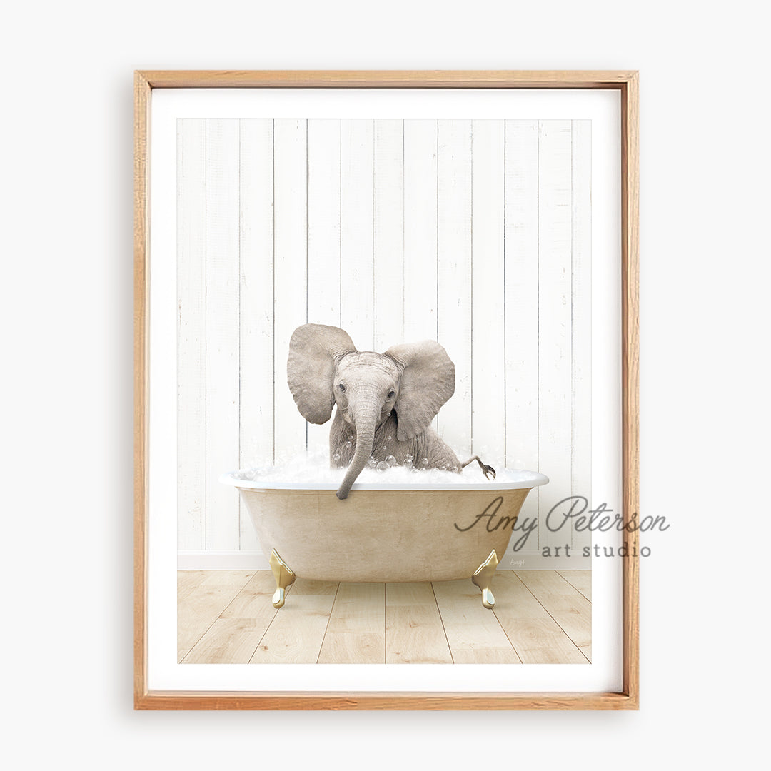 a picture of an elephant taking a bath