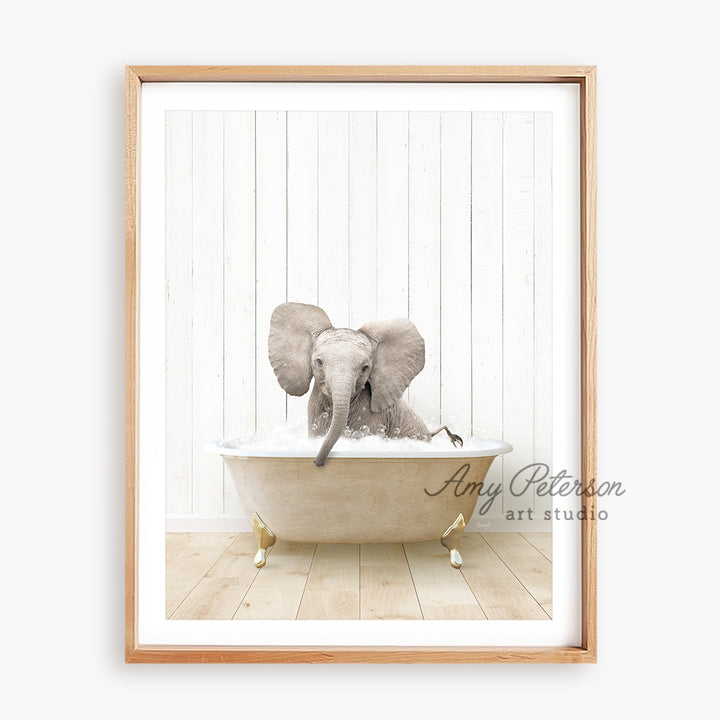 a picture of an elephant taking a bath