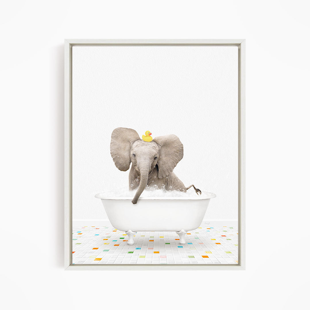 A baby elephant sitting in a white bathtub, with a yellow rubber duck floating on its head.
