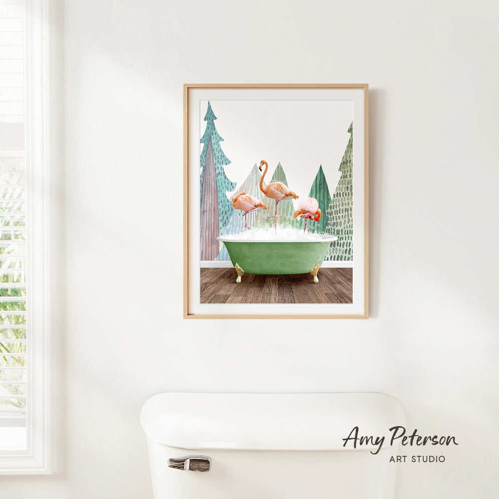 A framed painting of two flamingos standing in a green bathtub, with a snowy landscape in the background.