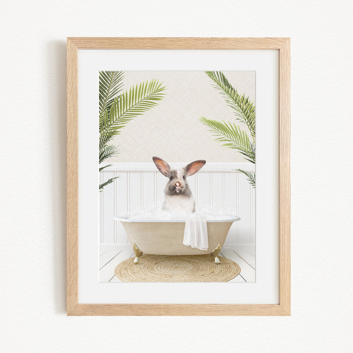 A white rabbit sitting in a bathtub filled with bubbles, surrounded by green palm leaves, creating a whimsical and playful scene.