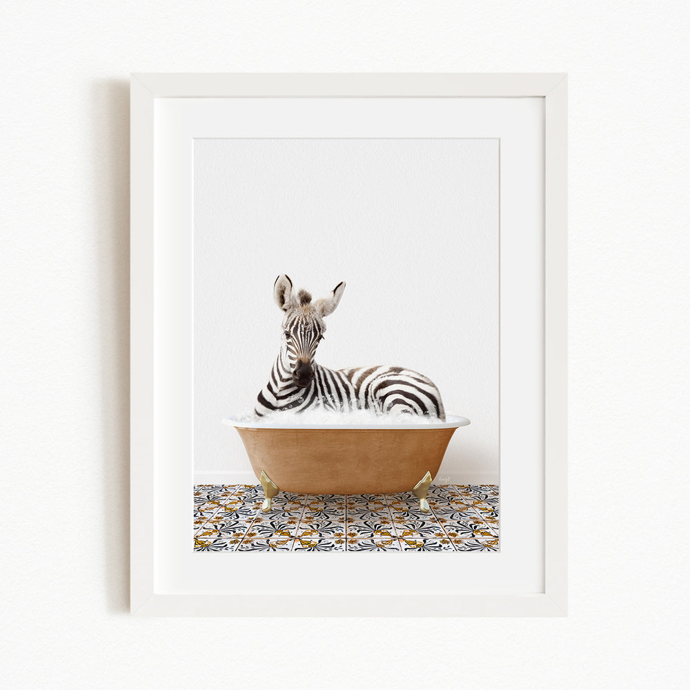 A zebra is sitting in a bathtub filled with water, surrounded by a patterned tile floor.