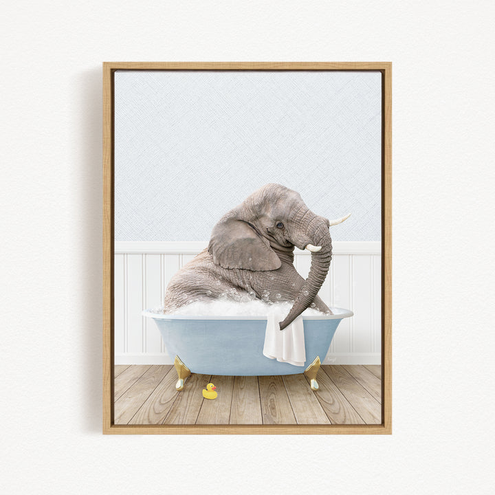 A gray elephant sitting in a blue bathtub filled with water, surrounded by yellow rubber duckies.