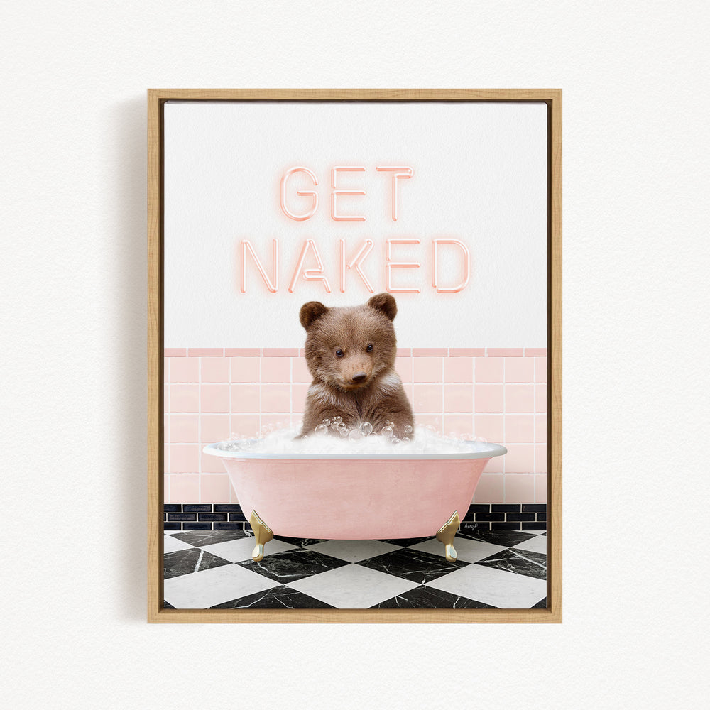 A cute brown bear sitting in a pink bathtub filled with bubbles, with the text "GET NAKED" displayed above it.