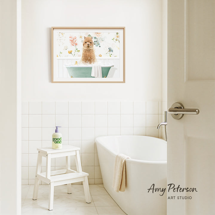 A framed painting of a dog sitting in a bathtub is hanging on the wall above a white bathtub in a bathroom.