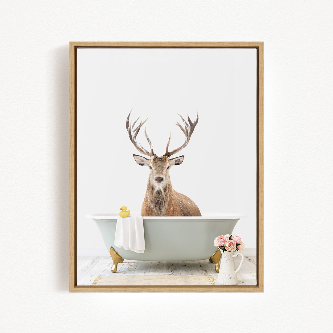 A deer with antlers is sitting in a bathtub, surrounded by flowers and a rubber duck.