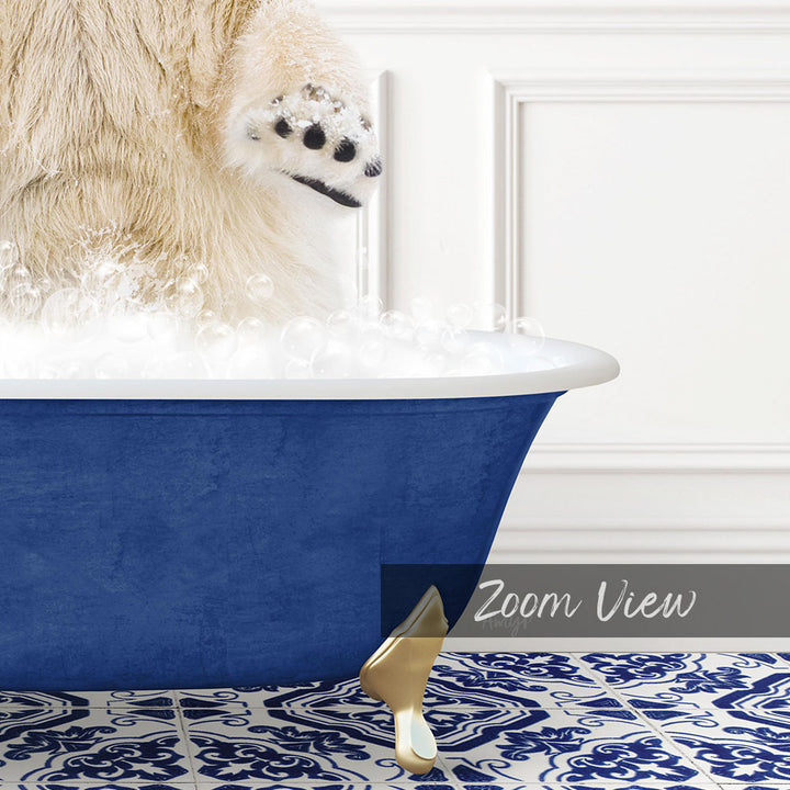 A fluffy white dog is standing in a blue bathtub filled with bubbles, with its paw raised in the air.