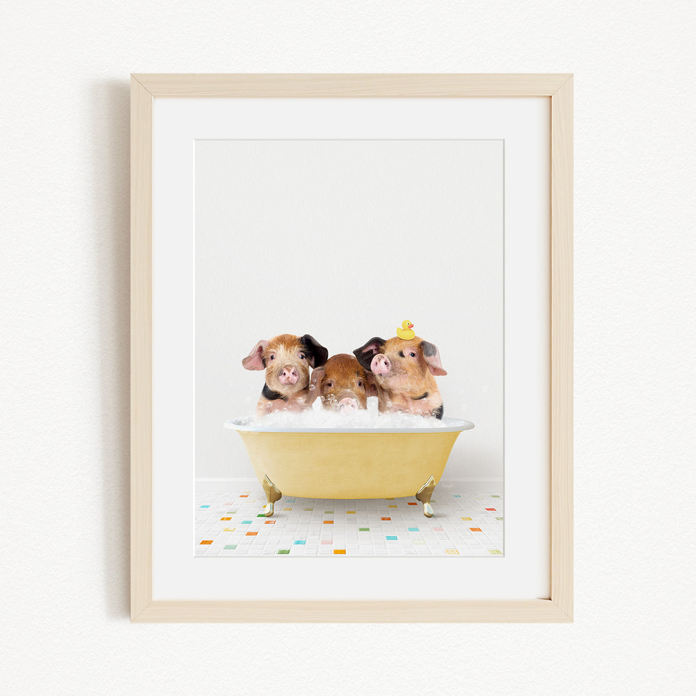 Three adorable pigs sitting in a yellow bathtub, enjoying a relaxing bath together.