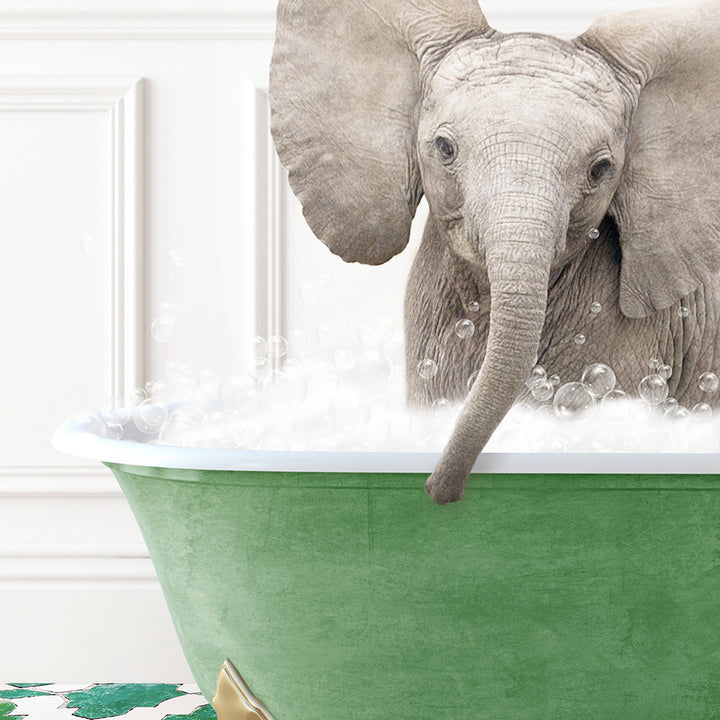 a baby elephant standing in a bathtub full of bubbles