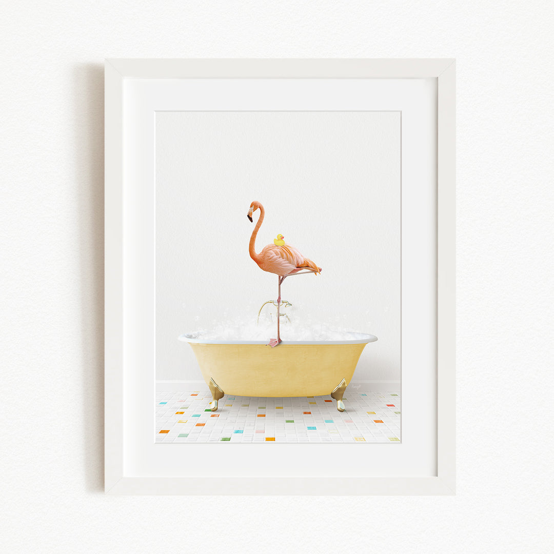 A framed image depicting a pink flamingo standing on a yellow bathtub filled with water, surrounded by a colorful tiled floor.