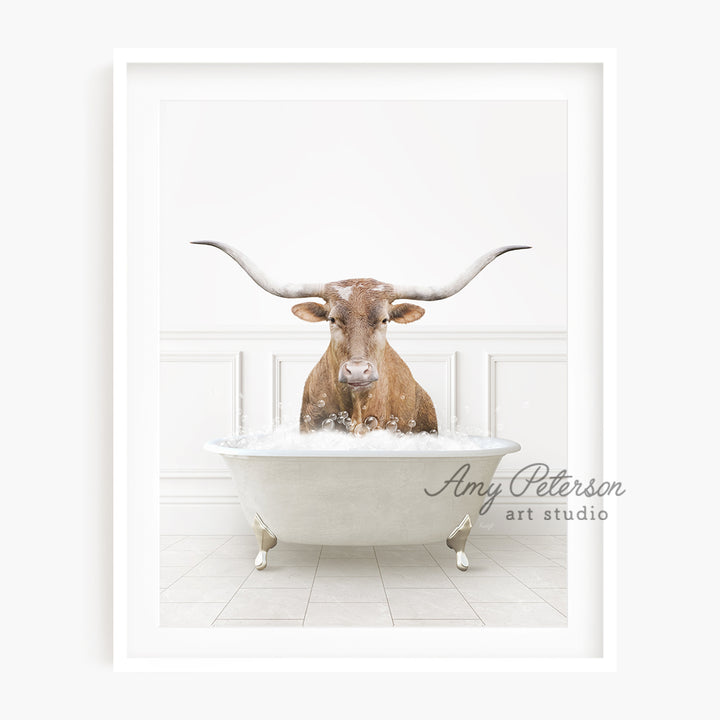 a cow with long horns sitting in a bathtub