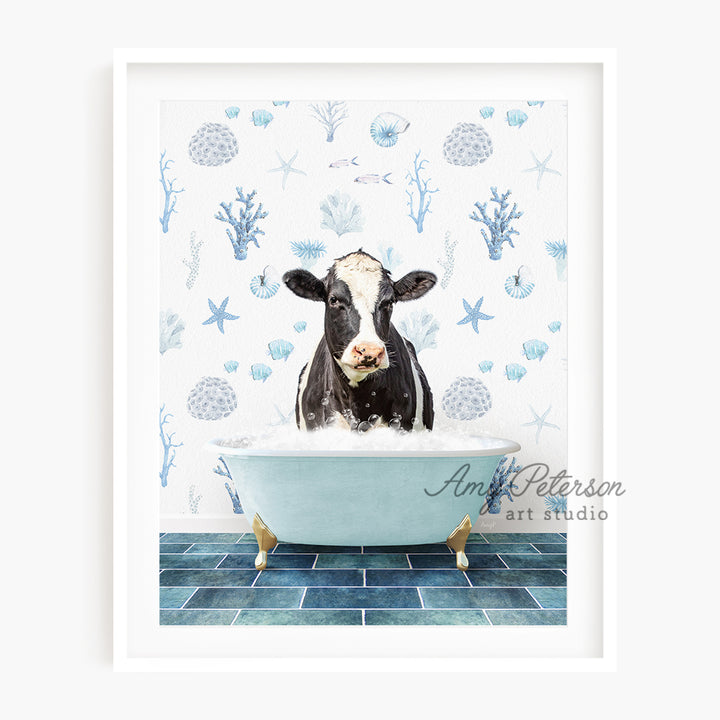 a black and white cow is sitting in a bathtub