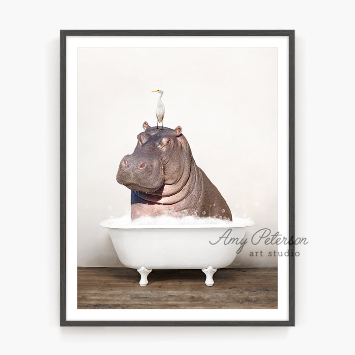 a hippo in a bathtub with a bird on top of it