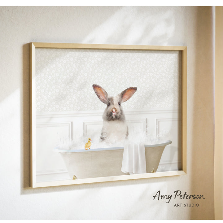 A gray rabbit sitting in a bathtub filled with bubbles, accompanied by a yellow duck.