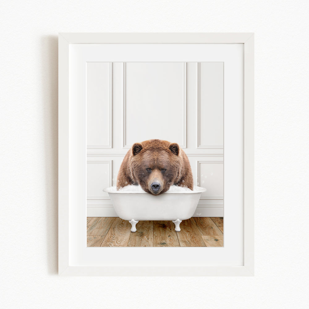 A brown bear is sitting in a white bathtub, appearing to be enjoying a relaxing bath.