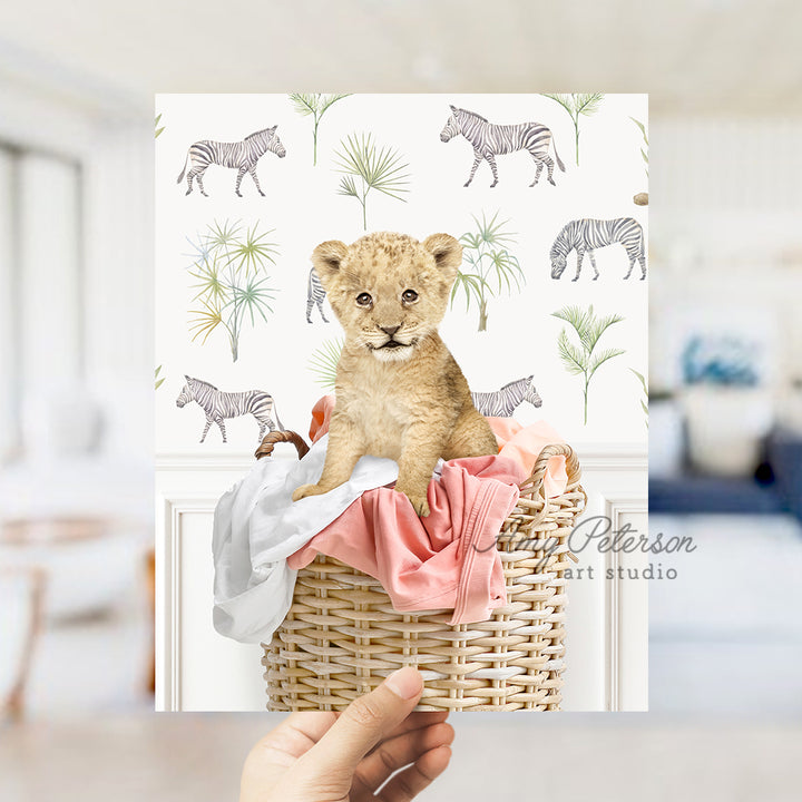 a person holding a card with a picture of a baby bear in a basket