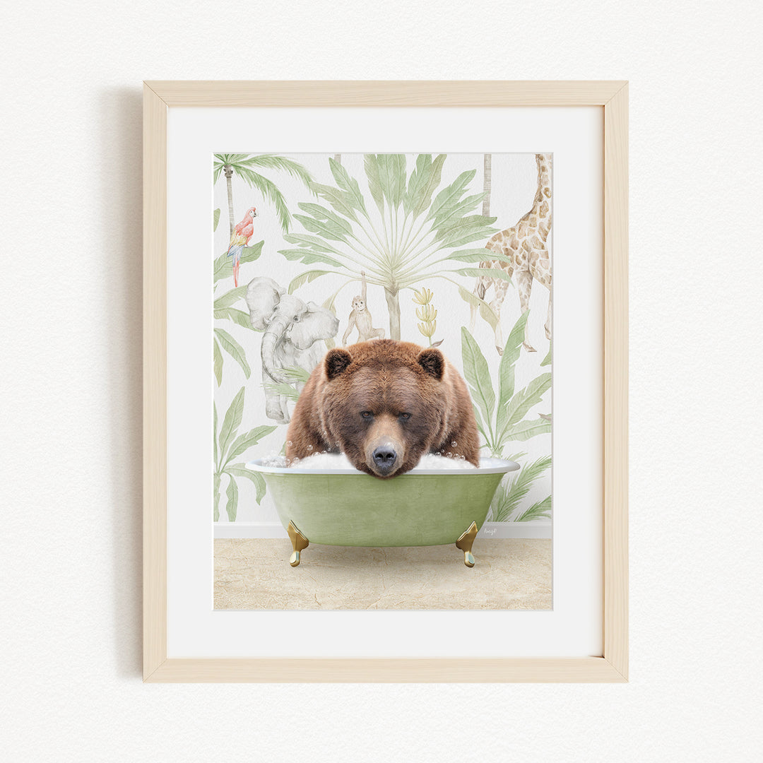 A framed image depicting a brown bear sitting in a green bathtub, surrounded by tropical foliage and animals.