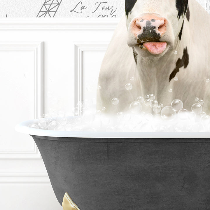 a cow sticking its tongue out in a bathtub filled with bubbles