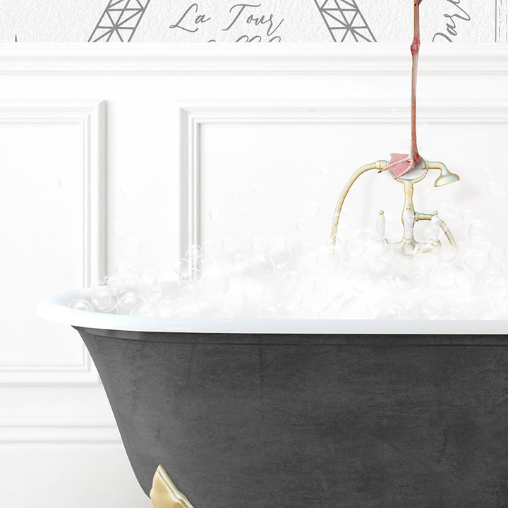 a bathtub filled with white foam and a pink flower