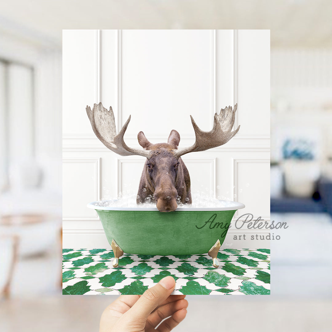 a person holding up a card with a moose in a bathtub