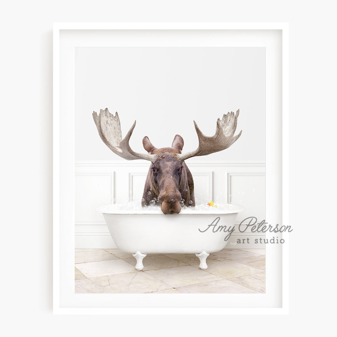 a moose in a bathtub with antlers on his head