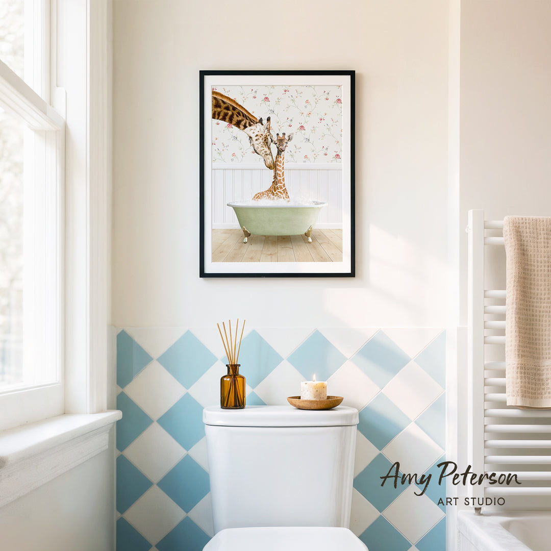 A framed print of a giraffe sitting in a bathtub is displayed on the wall above a white toilet in a bathroom with blue and white checkered tiles.