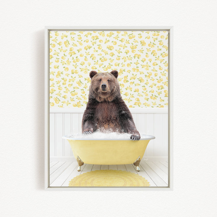 A brown bear sitting in a yellow bathtub filled with water, surrounded by a yellow floral pattern on the wall behind it.