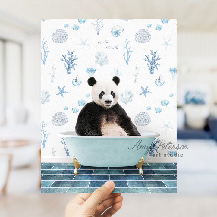 a panda bear sitting in a blue bath tub