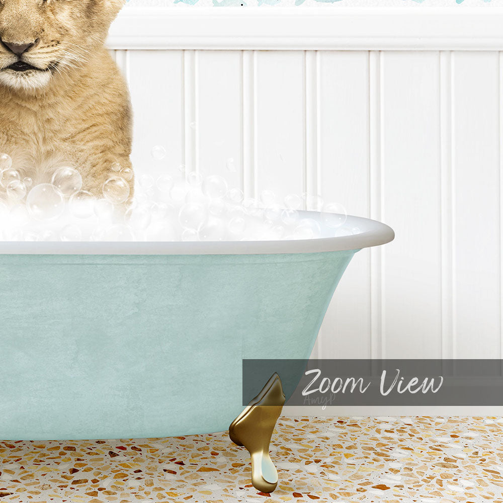 A cat is sitting in a light blue bathtub filled with bubbles, with a gold faucet and a text overlay indicating a "Zoom View" perspective.