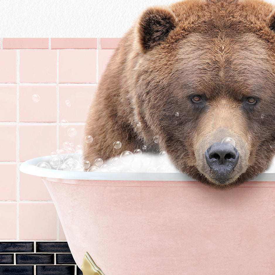 a brown bear taking a bath in a bathtub