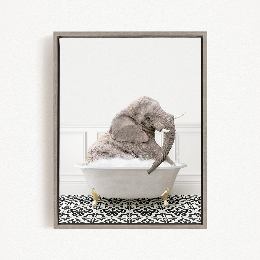 A gray elephant sitting in a white bathtub filled with bubbles, surrounded by a black and white patterned floor.