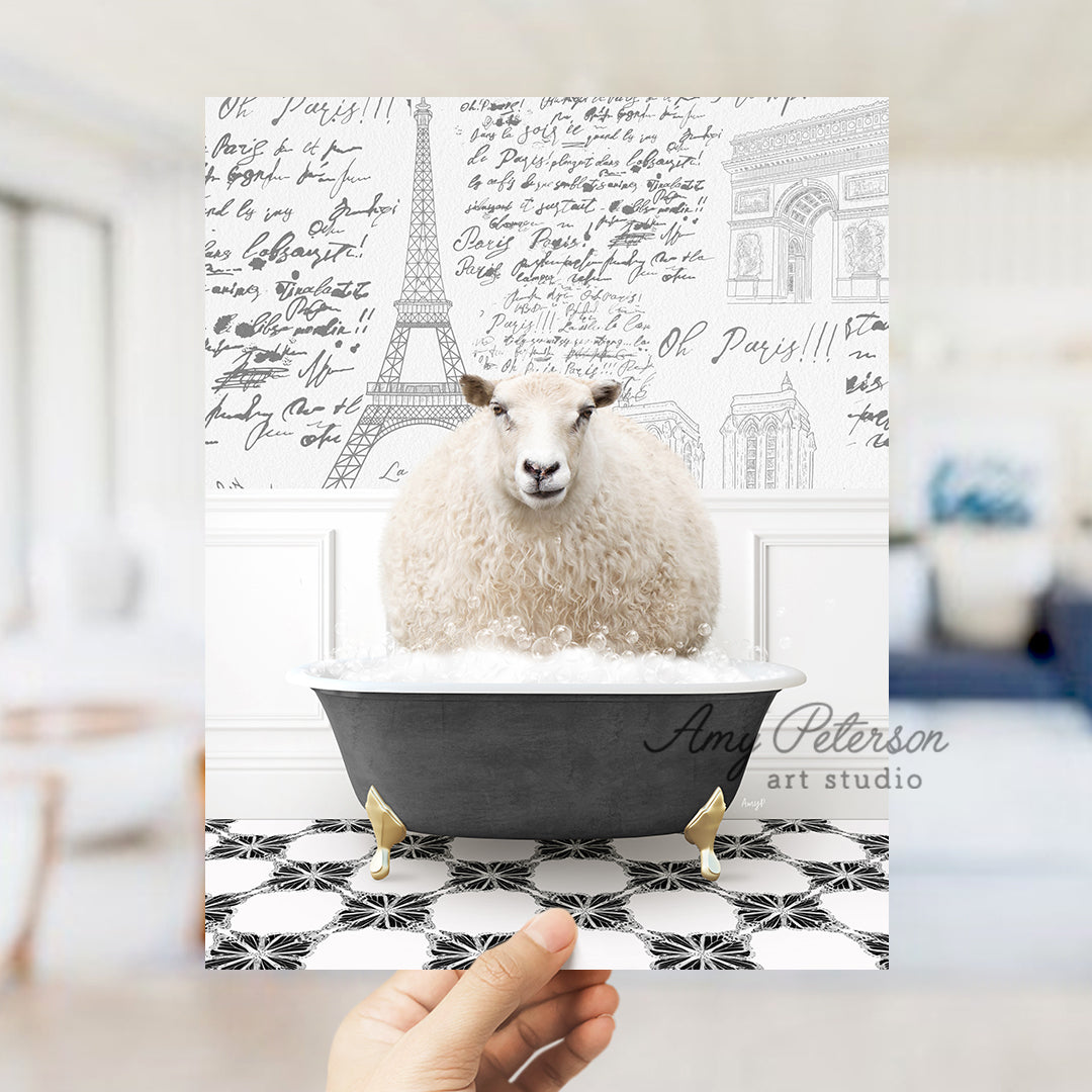 a person holding a card with a picture of a sheep in a bathtub