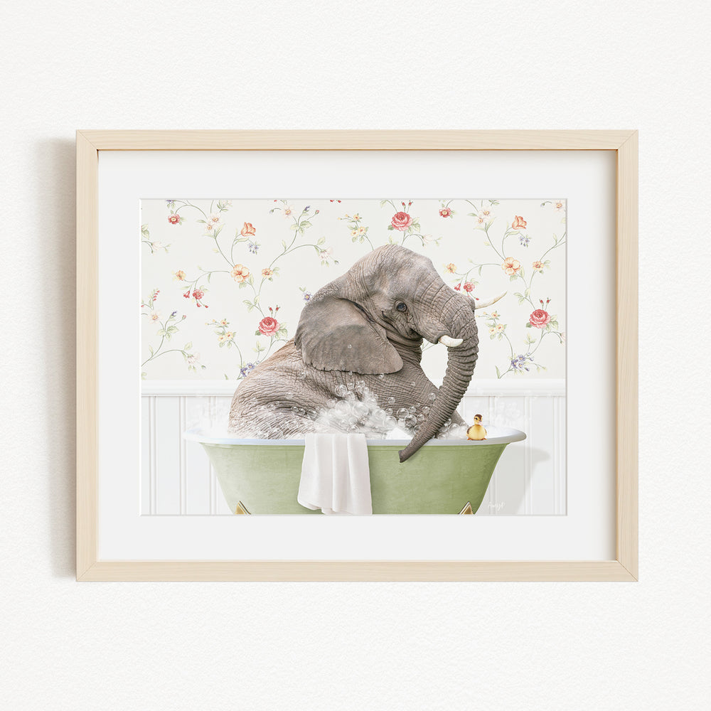 A gray elephant is sitting in a green bathtub filled with water, surrounded by a floral patterned wall.