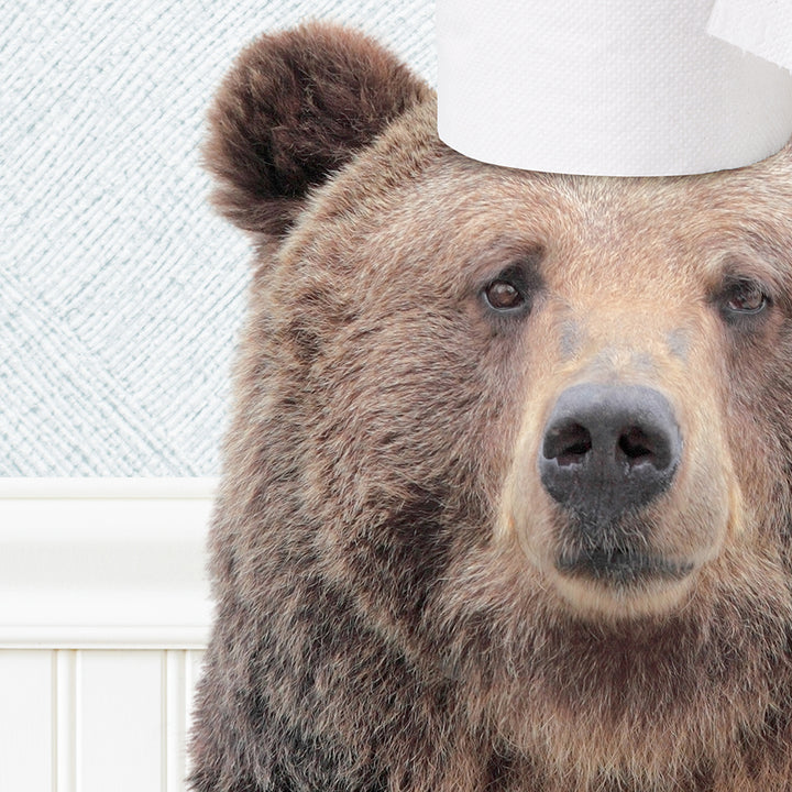 a brown bear with a paper hat on its head