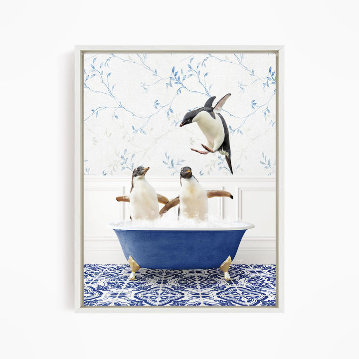 A framed image depicting two penguins sitting in a blue bathtub, with one penguin flying towards the other in mid-air.