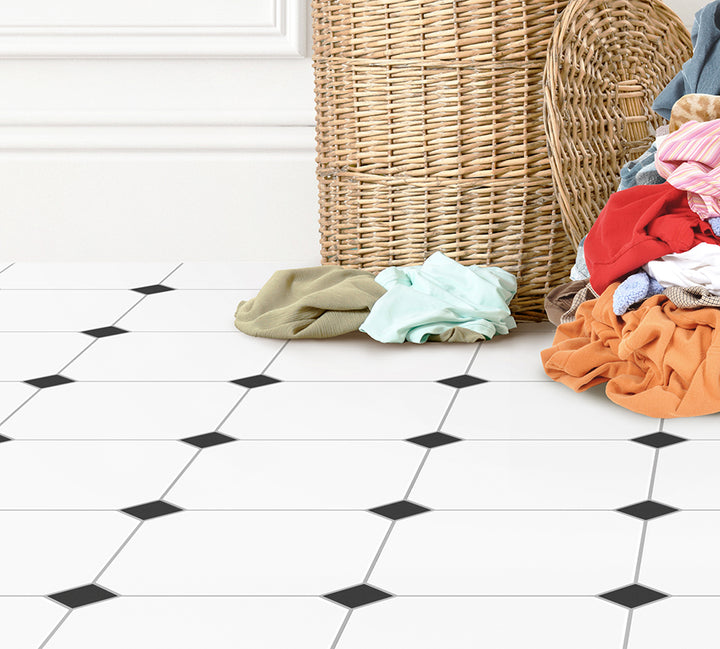 a pile of clothes sitting next to a wicker basket