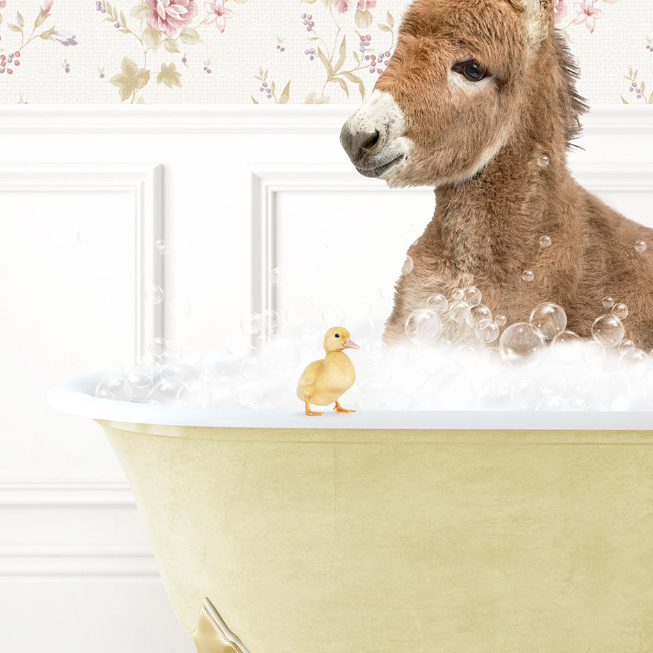 a donkey in a bathtub with bubbles and a rubber duck